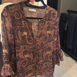 Halogen chiffon like top with v neck and ruffle sleeves.